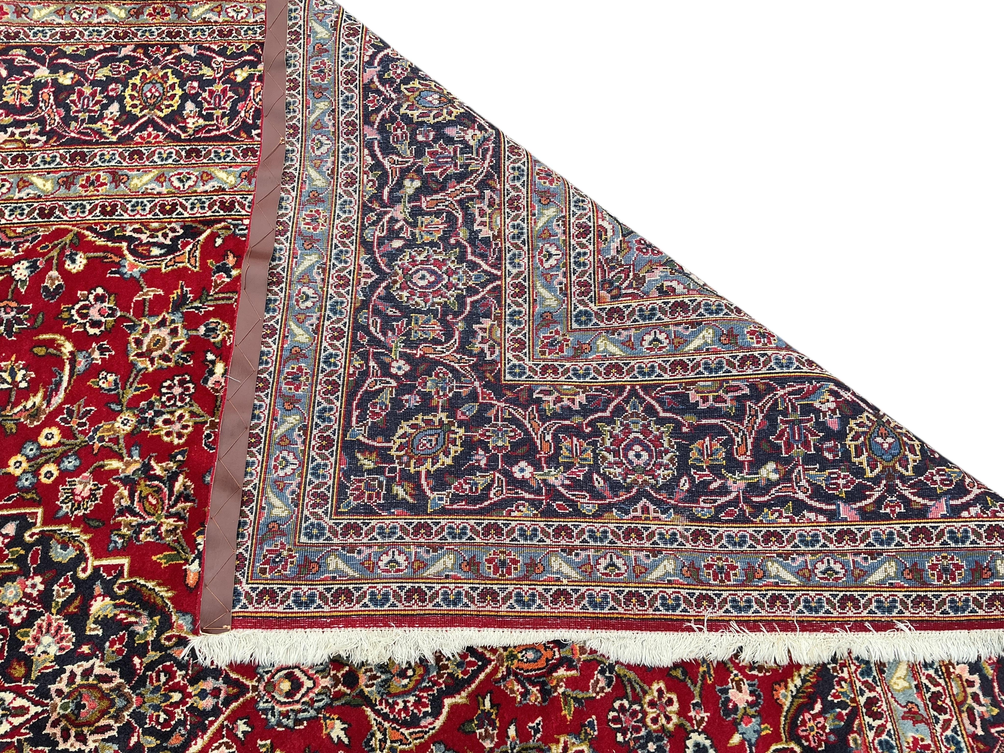 A Nadjafabad blue ground carpet, 346 x 248cm